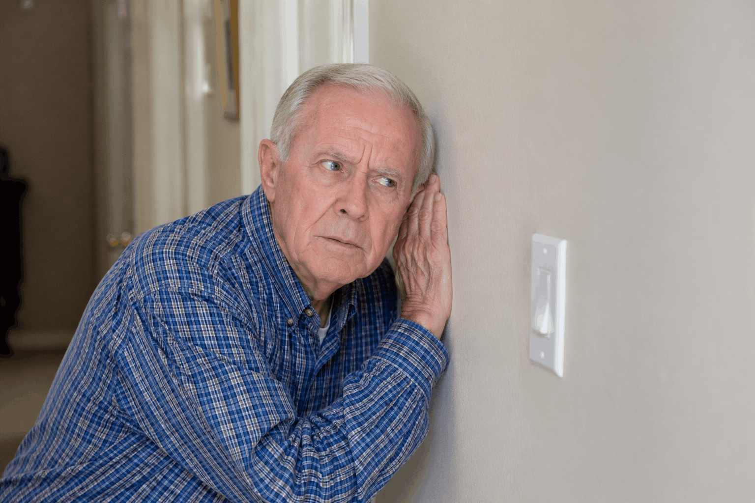 Man hearing sounds in wall from noisy pipes