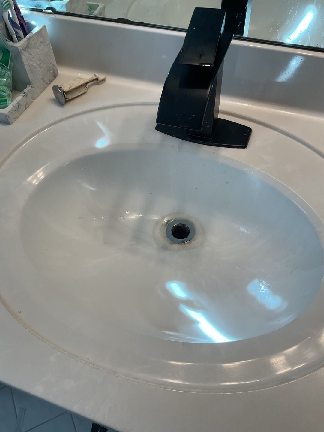 Lav sink buildup in bathroom drain area
