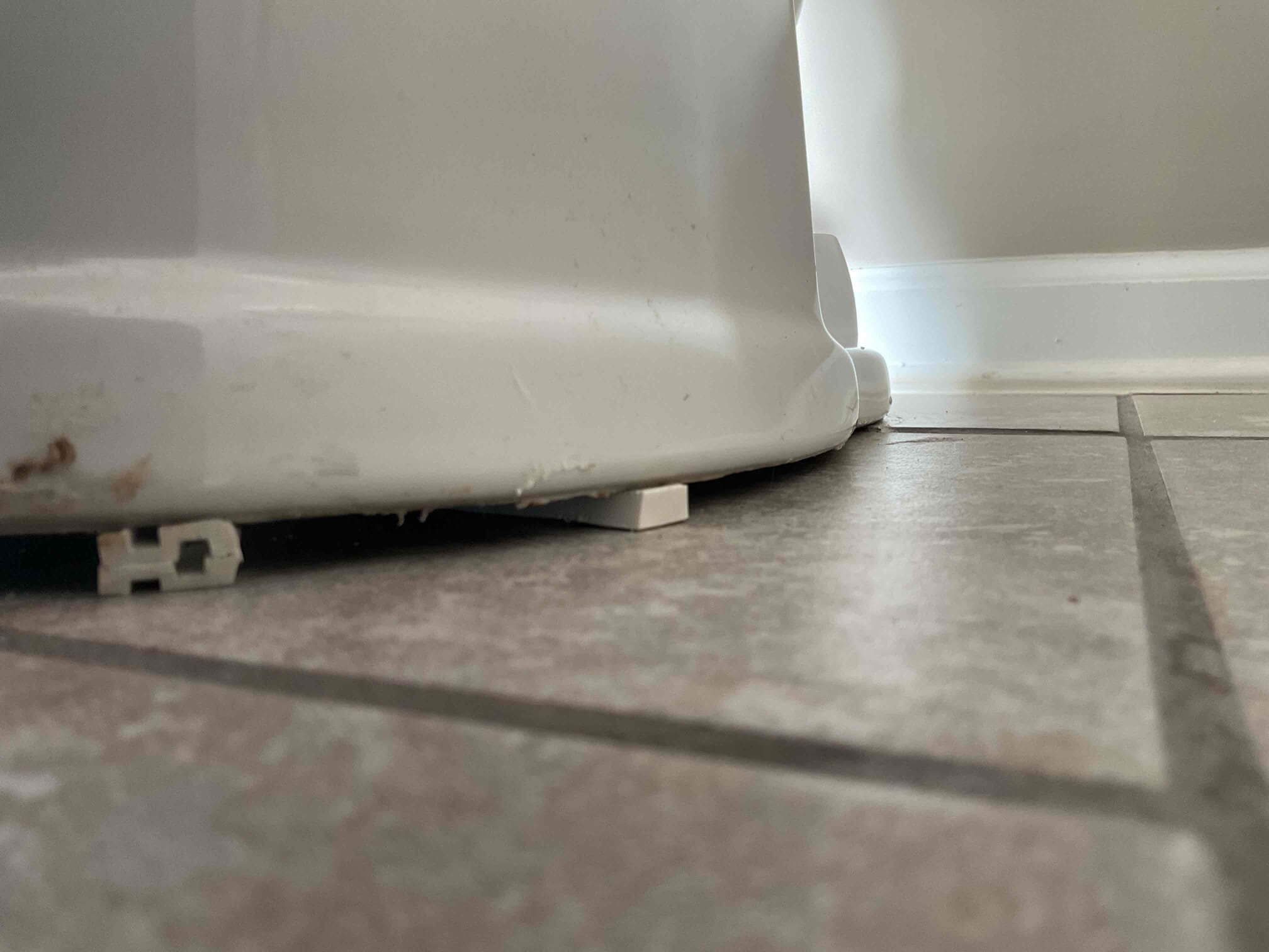 Rocking toilet base damage