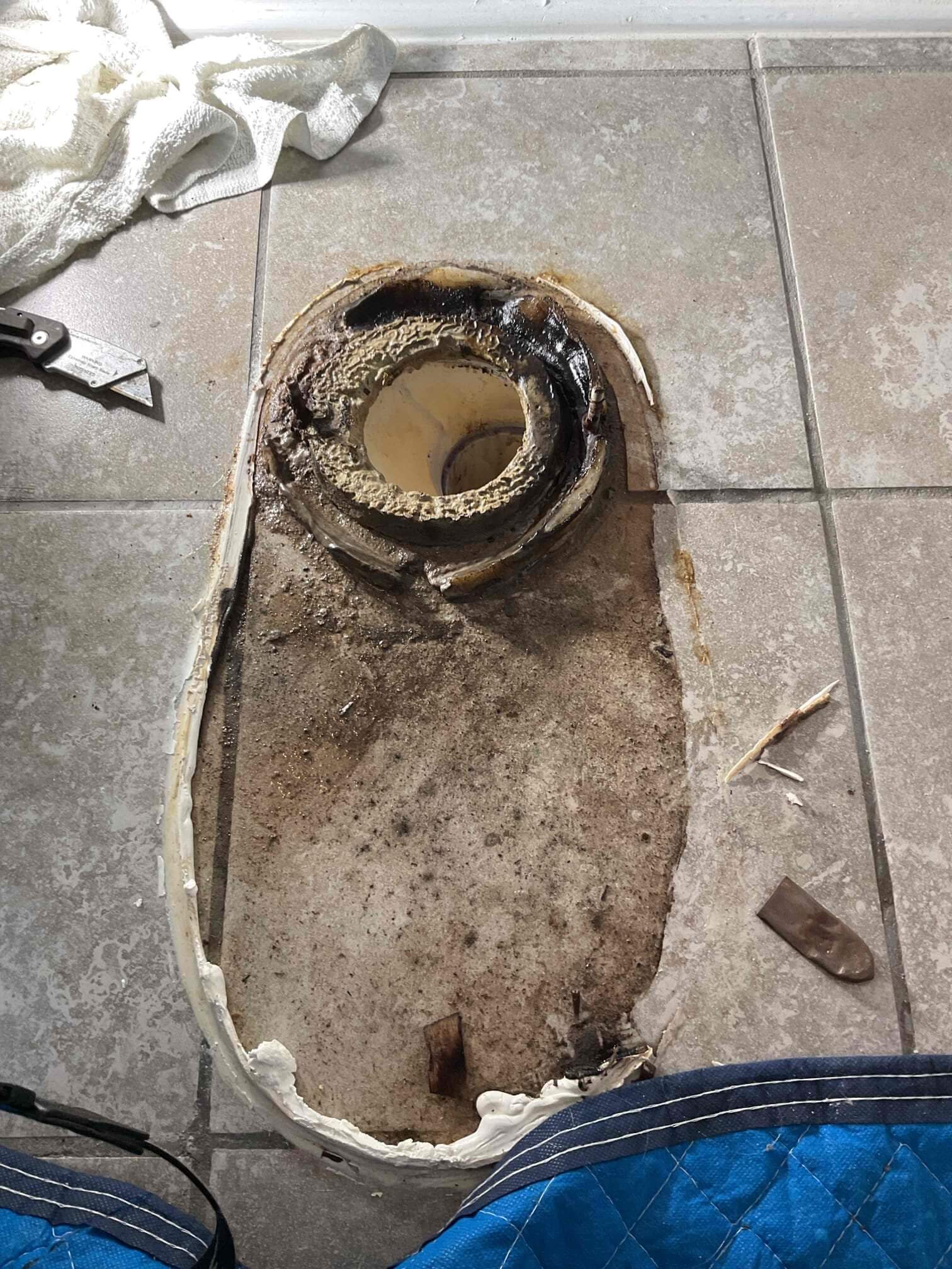 Water around toilet base